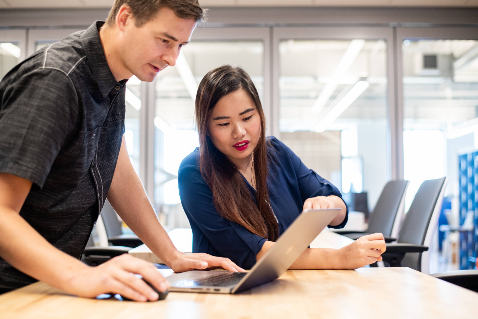 Jeff VanOss and Diana McCrumb, BAMF research engineers, look at the results of a 3D scan at the BAMF Health headquarters in Grand Rapids. Both are biomedical engineering graduates from Grand Valley. (Photo releases on file)